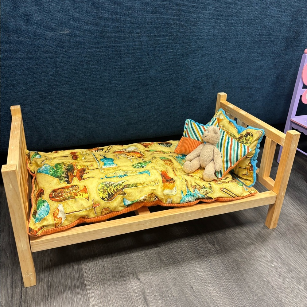 Wood bed frame with fun cushions for dolls